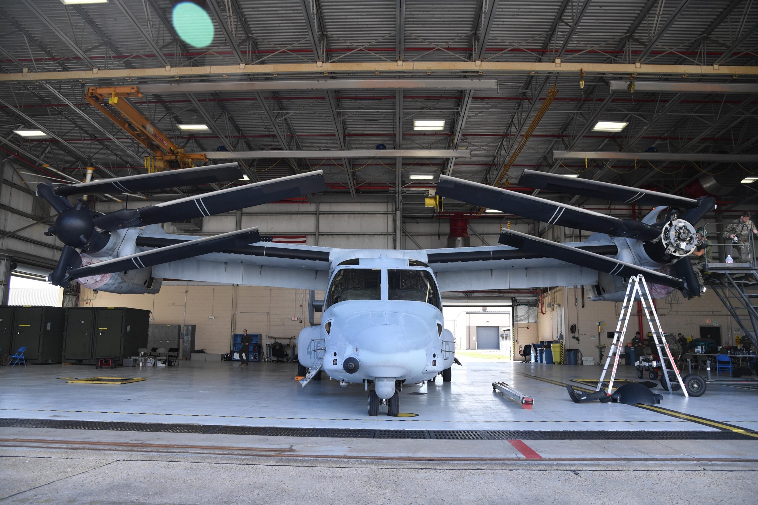 A MV-22B Osprey from the Marine Medium Tiltrotor Squadron 774, Naval Air Station Norfolk, Virginia, receives routine maintenance inside a hangar at Keesler Air Force Base, Mississippi, Oct. 23, 2020. Marines came to Keesler to conduct routine training operations in and around the Mississippi area. (U.S. Air Force photo by Kemberly Groue)