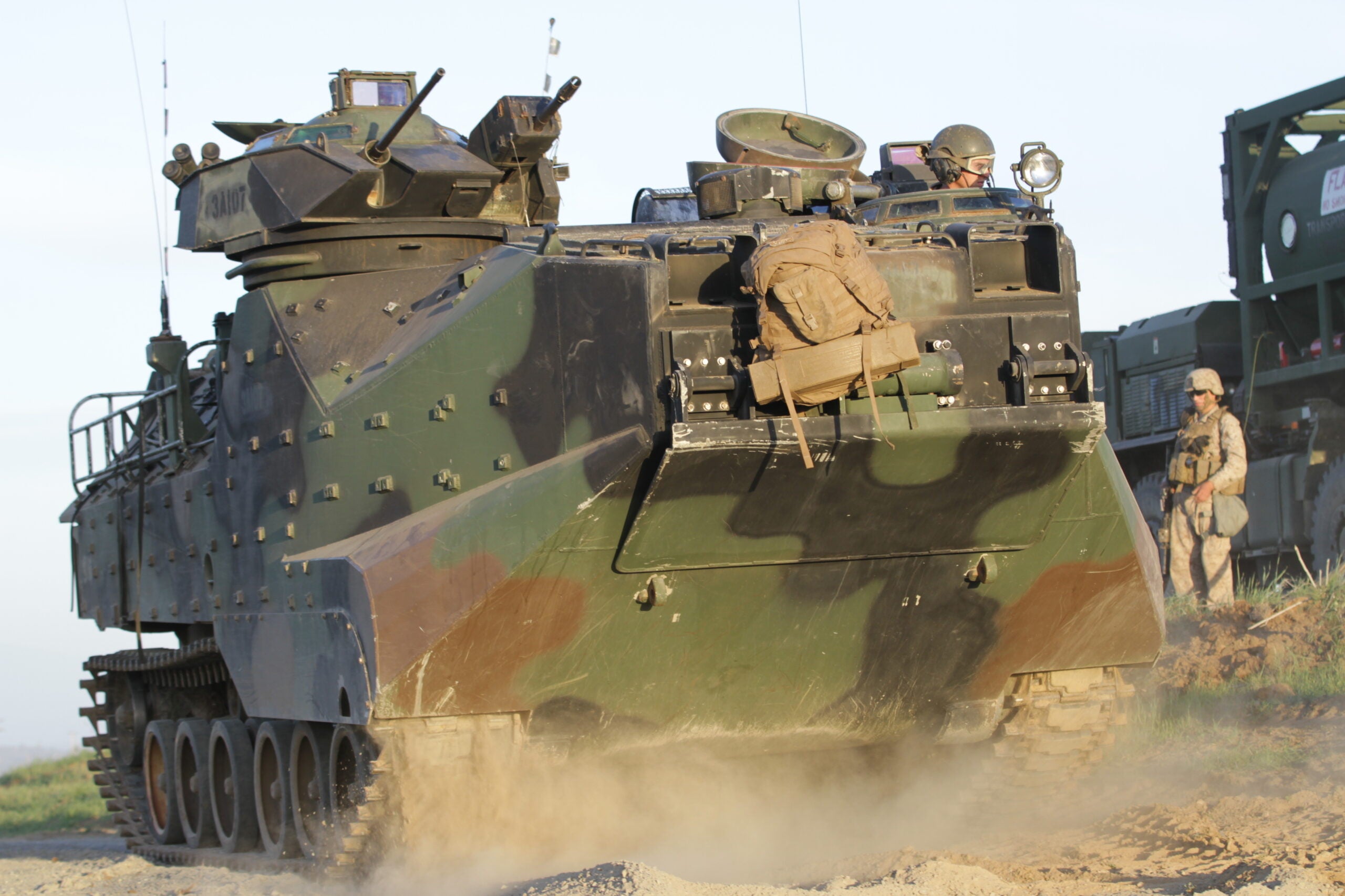 Lance Cpl. Thomas Mason, an amphibious assault vehicle crew member with Alpha Company, 3rd Amphibian Assault Battalion, and a native of Irmo, S.C., drives an AAV during a Marine Corps Combat Readiness Evaluation aboard Marine Corps Base Camp Pendleton, Calif., March 20, 2014. The MCCRE is a week long exercise that tests Marines' combat readiness through a variety of scenarios. Raids, gas drills and casualty evacuations are among the tests used to evaluate the Marines. (U.S. Marine Corps photo by Lance Cpl. David Silvano/released)