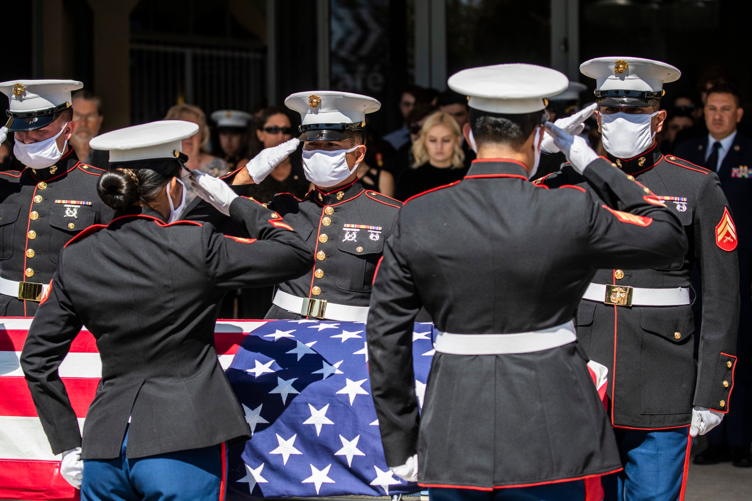 ROSEVILLE, CA - SEPT. 18: U.S. Marines pallbearers salute the casket of Sgt. Nicole L. Gee during a public memorial service at Bayside Church Adventure Campus in Roseville, Calif. Saturday, Sept. 18, 2021. Gee, 23, assigned to Combat Logistics Battalion, 24th Marine Expeditionary Unit, II Marine Expeditionary Force, Camp Lejeune, North Carolina, died in a bombing attack at Hamid Karzai International Airport in Kabul, Afghanistan on August 26, along with 12 other U.S. service members. (Stephen Lam/The San Francisco Chronicle via Getty Images)